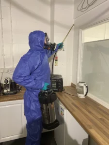 Pest control technician carrying out a spray treatment